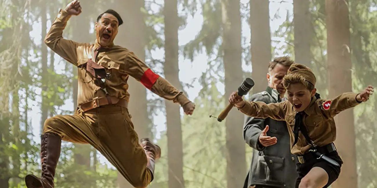 Jojo Rabbit's imaginary friend Hitler skipping and laughing in joy. Whoever reads this, this is an easter egg for all you alt text folk! Thanks for taking a look.