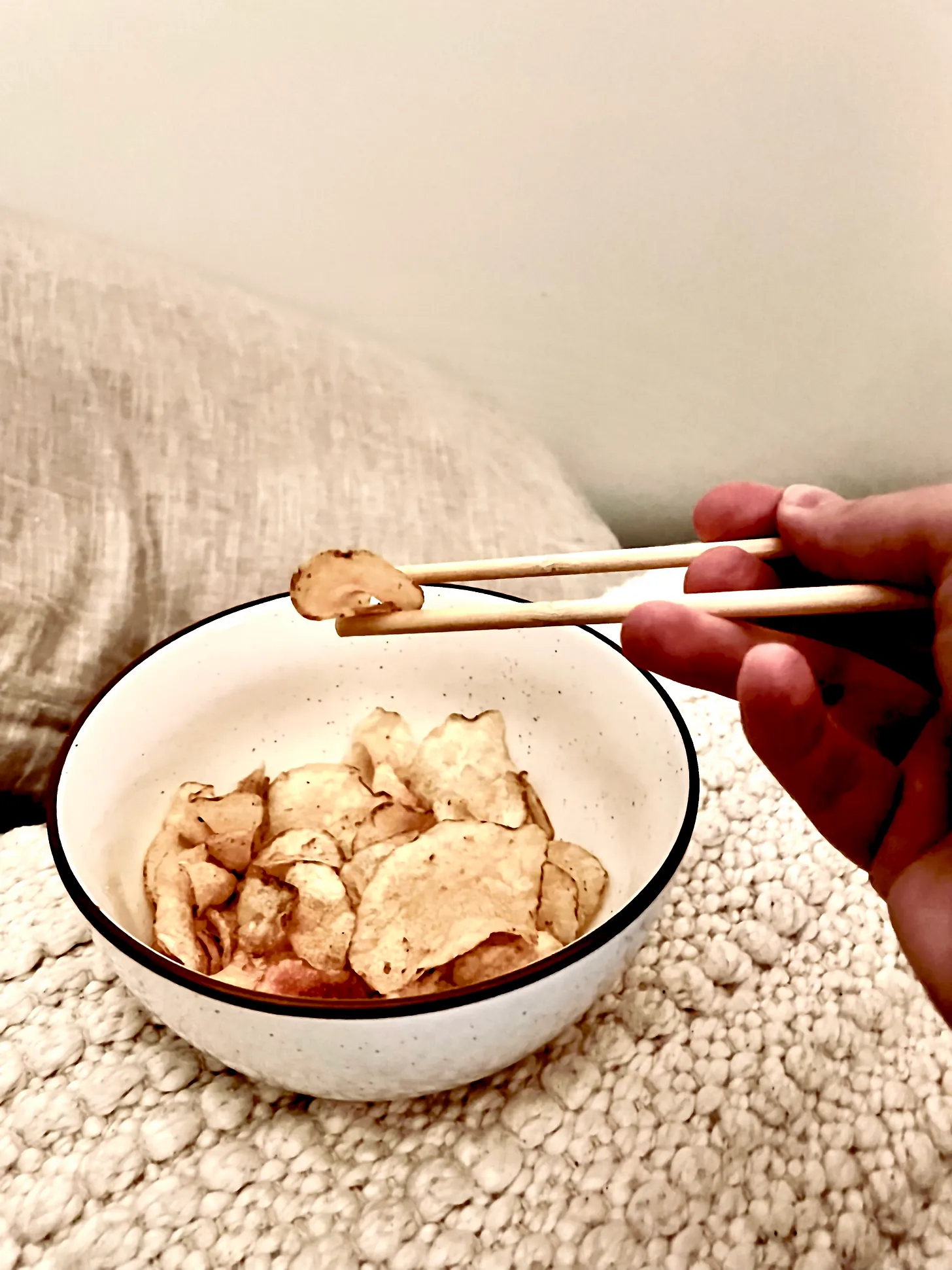 eating potato chips with chopsticks