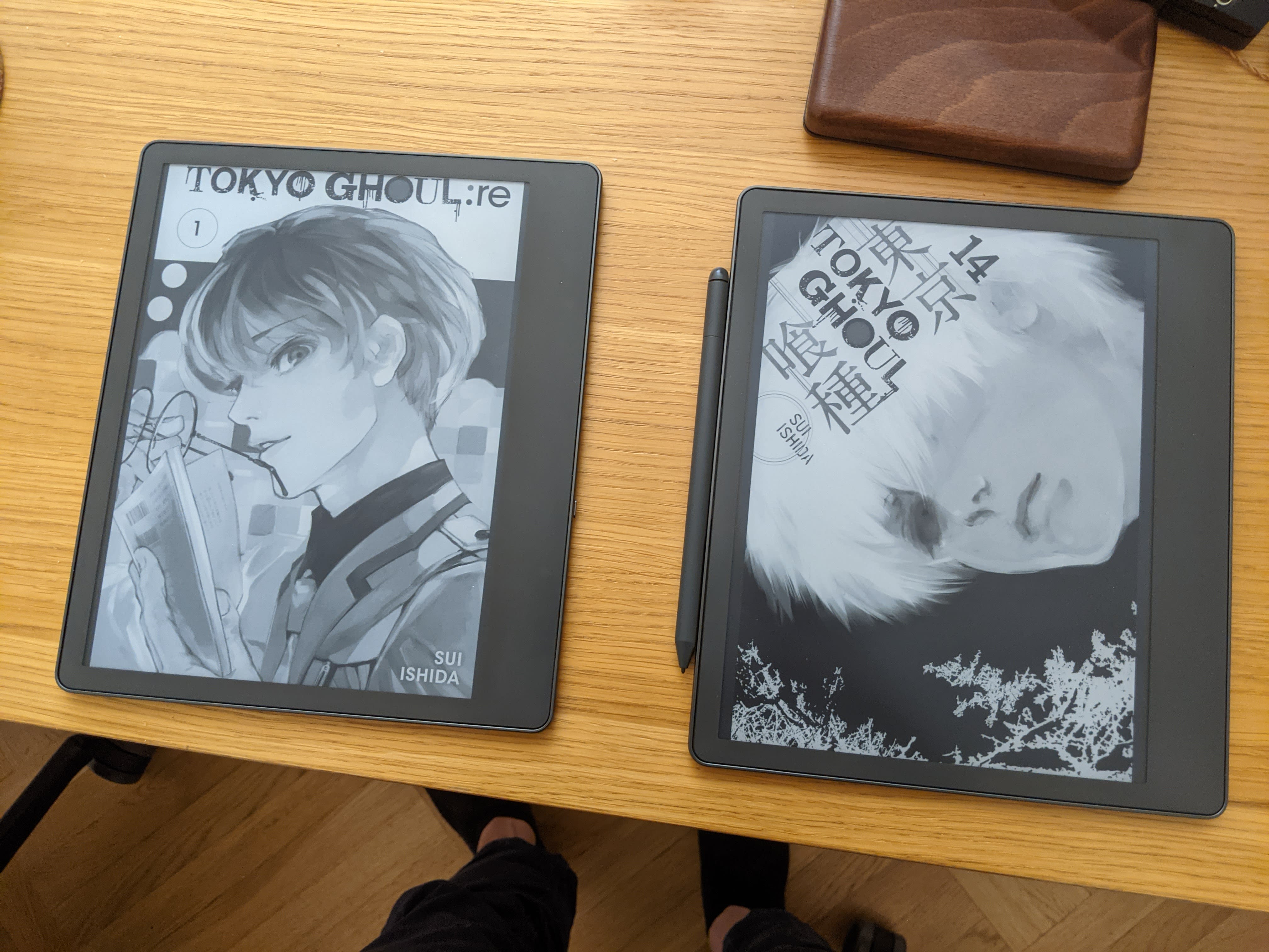Two Kindle Scribes, each with a manga cover on them